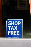 shop tax free text duty free shop sign on shop window photo