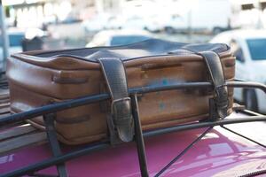 retro car with luggage on the roof . photo