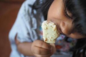 Child Hand Holding Ice Cream photo