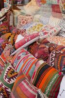 Colourful cushions on display for sale in a traditional Turkish Bazaar. photo