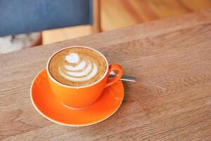 Coffee cup on wood table photo