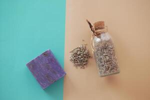 Homemade natural soap bar and lavender flower on table photo