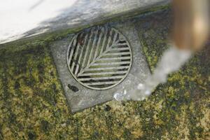 water pouring from a faucet tap outdoor in istanbul photo