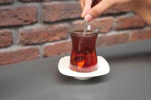 Traditional turkish tea on white table . photo