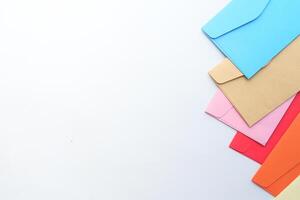 Group of colored envelopes on white background. Creative layout photo