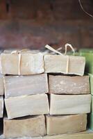 stack of natural soap bar on table photo