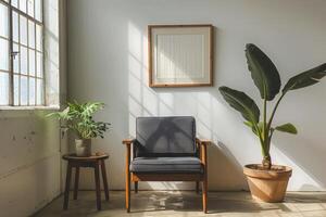 Minimalistic light interior design with gray armchair, plant and picture frame mockup. Sunbright photo