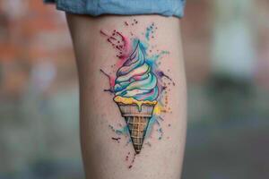 Rainbow ice cream cone tattoo on leg. photo