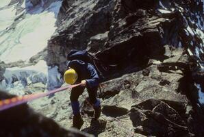 Climber rappelling cascades photo