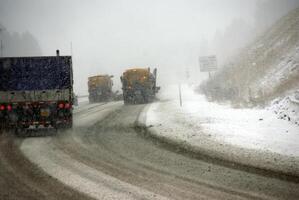 Snow plows keep the road open photo