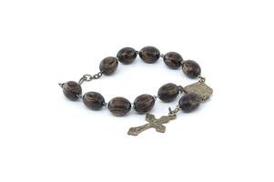 Rosary with wooden beads isolated on white background photo