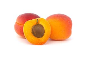 Pile of ripe apricots isolated on a white background photo