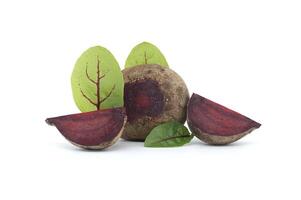 Slices of beetroot and fresh green leaves isolated on white photo