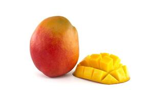 Ripe mango fruit and cubed cut half mango isolated on white photo