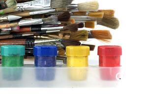 Assortment of various types and sizes of paintbrushes photo