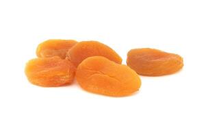 Dried apricots fruits isolated on white background photo