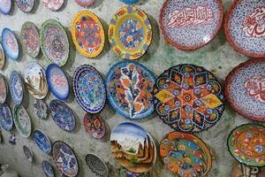 Brightly colored porcelain dishes from pottery factory photo