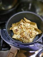 Crisping dim sum shumai in an air fryer photo