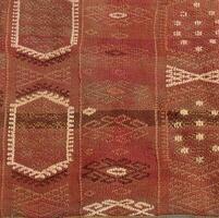 Turkish kilim with orange and brown, red patterns photo