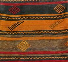 Turkish kilim with orange and brown, red patterns photo