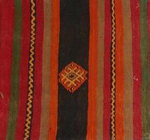 Turkish kilim with orange and brown, red patterns photo