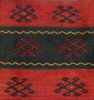 Turkish kilim with orange and brown, red patterns photo