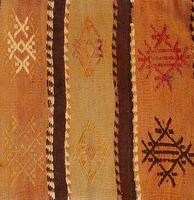 Turkish kilim with orange and brown, red patterns photo