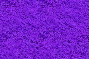 purple texture for background design. natural purple pigment top view. photo