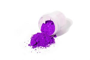 a bunch of dry natural purple pigment on a white background macro photo