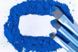 dry natural ultramarine paint with white space for text. macro photo