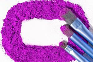 pink loose powder, pink ultramarine, ochre, purple on a white. place for text photo
