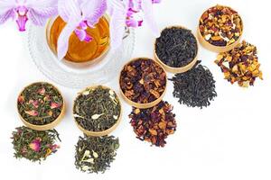 different types of tea on a white background. a kind of delicious fruit tea. photo