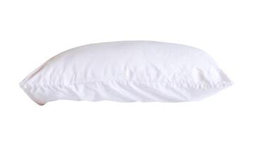 Side view of white pillow with case after guest's use in hotel or resort room isolated on white background with clipping path. Concept of comfortable and happy sleep in daily life photo