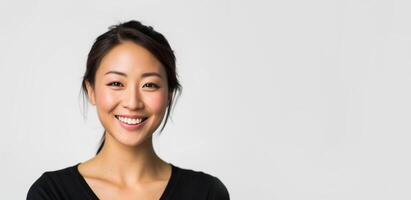 Young asian woman with dark brunette hair smiling with copy space. Happiness, white teeth, smooth skin tone, natural beauty, joyful positive concept photo