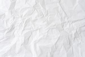 Wrinkled or crumpled white stencil paper or tissue paper after use with large copy space used for background texture in decorative art work photo