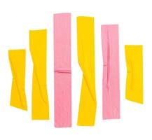 Top view set of wrinkled yellow and pink adhesive vinyl tape or cloth tape in stripes shape isolated on white background with clipping path photo