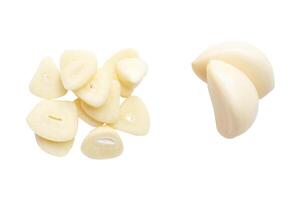 Top view set of peeled garlic cloves with slices or pieces in stack isolated on white background with clipping path photo