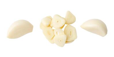 Top view set of peeled garlic cloves and slices or pieces in stack isolated on white background with clipping path photo