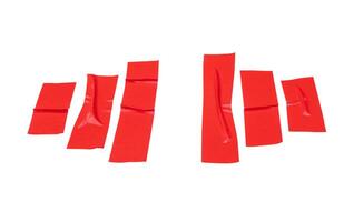 Top view set of wrinkled red adhesive vinyl tape or cloth tape in stripes isolated on white background with clipping path photo