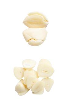 Top view set of fresh pounded garlic cloves and slices in stack isolated on white background with clipping path photo