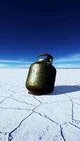 old rusted danger gas container on salt lake video