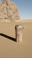 A stone pillar in the middle of a desert video