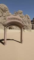 A small arch in the middle of a desert video