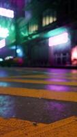 A city street at night with neon lights video