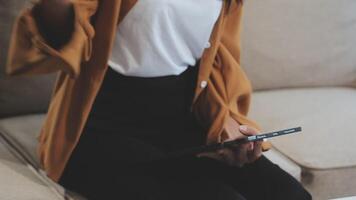 Asian Businesswoman Using laptop computer and working at office with calculator document on desk, doing planning analyzing the financial report, business plan investment, finance analysis concept. video