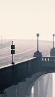 View of the bridge over the river in fog video