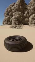 A tire sitting in the middle of a desert video