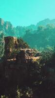 A scenic view of a mountain range with trees and rocks video