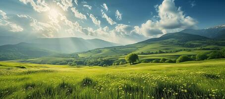 Idyllic summer landscape with meadow, hills, panorama of countryside in sunlight. Springtime landscape with grassy field and rolling mountains. Rural scenery photo