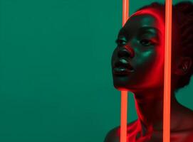 African American young woman with her face lit by vertical glowing red neon tubes. Black history conceptual background photo